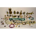 A quantity of costume jewellery and brass ornaments, to include silver ingot, silver chain, beads,