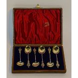 A boxed set of six silver apostle teaspoons, hallmarks for Birmingham 1899 M Bro,