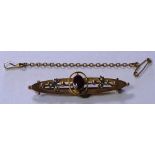 A Victorian 9ct gold garnet and seed pearl brooch, stamped 9ct, 2.