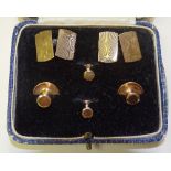A boxed set of 9ct gold cufflinks and studs, the cufflinks with engine turned decoration,