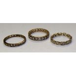 Three 9ct gold and paste eternity rings, stamped 9ct, ring size O & K, 5.