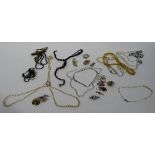 A small quantity of costume jewellery, to include faux pearls, brooches, rings, necklaces, beads,