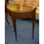A Georgian style mahogany demi-lune card table, with pull out back support, terminating on pad foot,