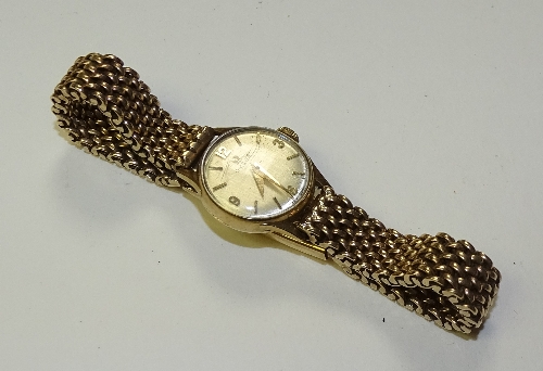A 9ct gold lady's Omega wristwatch circa 1960s, the silvered dial with baton and Arabic numerals,