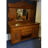 A carved oak mirror back sideboard circa early 20th century, the mirrored top,