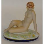 A Royal Dux figure of a seated nude, on naturalistic grass base, no.