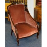 An Edwardian mahogany drawing room armchair,