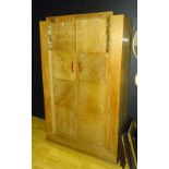 An Art Deco oak wardrobe circa 1930's, with two doors,