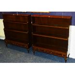 A pair of mahogany open waterfall bookcases,