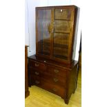 An Edwardian stained wood chest of drawers, with two small drawers above two long drawers,