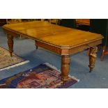 An oak extending dining table circa early 20th century, with additional leaf,