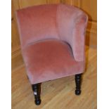 A vintage child's armchair, upholstered in later pink velour,