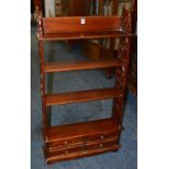 A reproduction open wall shelf in the Victorian style,