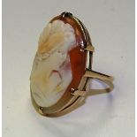 A large 9ct gold cameo ring, with bust of a lady carved to shell, 3 x 2cm, stamped 9ct, ring size R,