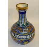A 19th century majolica vase, decorated in rich blues, oranges and yellows,