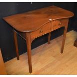 A mahogany & pine writing table circa early 20th century, with shaped top above two drawers,