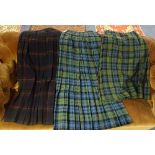 Three tartan kilts, in two different designs of McKinlay tartan,