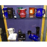 A quantity of pub jugs and ashtrays, mainly whisky themed,