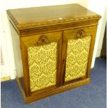 A Victorian rosewood chiffonier base, with two fabric panelled doors enclosing shelved interior,