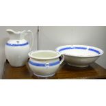 A blue and white pottery toilet set, comprising basin, ewer and chamber pot,
