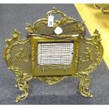 A Rococo style gilt metal electric fire, the frame decorated with cherubs,