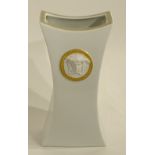 A Versace white ceramic vase by Rosenthal, decorated with moulded relief Versace emblem masks,