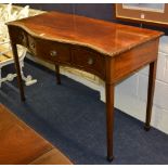 A Regency style mahogany serpentine hall table, with large drawer, flanked with a small drawer,