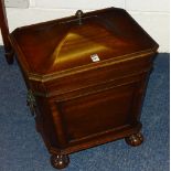 A Regency style mahogany sarcophagus shaped wine cooler,