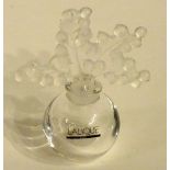 A Lalique crystal scent bottle, the stopper decorated with moulded berries,