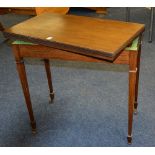 A mahogany fold over card table circa 1930's, the fold over top enclosing green felt lined interior,