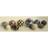 A mixed lot of Victorian style ceramic and marble effect carpet bowls,