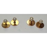 Two pairs of similar gold and pearl studs, one pair stamped 9ct,