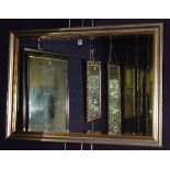 A modern gilt and silvered framed wall mirror,