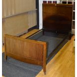 A vintage mahogany and ebony strung single bed with irons, 4ft high x 3.