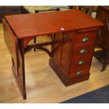 A vintage stained oak kneehole desk, of small form,