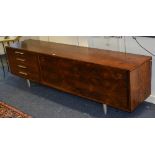 A Retro 1970's rosewood veneered sideboard in the style of Merrow Associates,