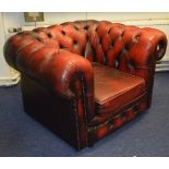 A Chesterfield ox blood leather club armchair,