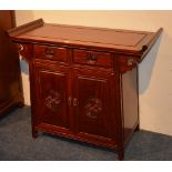 A Chinese hardwood cupboard chest,