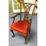 A Chippendale style carver armchair, with pierced splat back rest and velour covered stuffover seat,