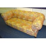 An Edwardian Chesterfield sofa, in later Kelim style upholstery,