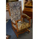 A late Victorian oak barley twist rocking chair, upholstered in later fabric,
