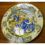 A majolica circular charger in the Urbino style circa 19th century, decorated with figures,