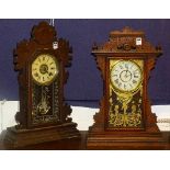 Two late Victorian gingerbread clocks, one manufactured by the Ansoia Clock Co, New York,