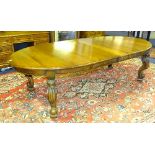 A Victorian style mahogany D-end extending dining table, with two additional leaves,