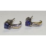 A pair of 18ct white gold tanzanite and diamond drop earrings, with triangle cut tanzanite to top,