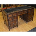 A vintage oak kneehole desk circa 1930's,