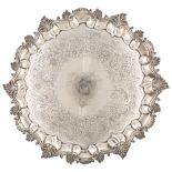 A CHASED EDWARD FARELL GEORGIAN STERLING SILVER SALVER, LONDON, 1825supported by four fall feel