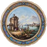 A SCENIC PAINTED PORCELAIN CHARGER, AFTER MEISSEN MANUFACTORYwith a sea village scene within a