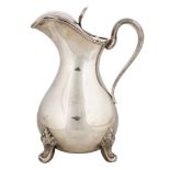 AN ANTIQUE SILVER WATER PITCHER, AUSTRIAN, 19TH CENTURYthe body of bulbous form, supported by four