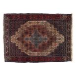 PERSIAN RUGdappled blue and red ground with a central cartouche165 x 118 cm.